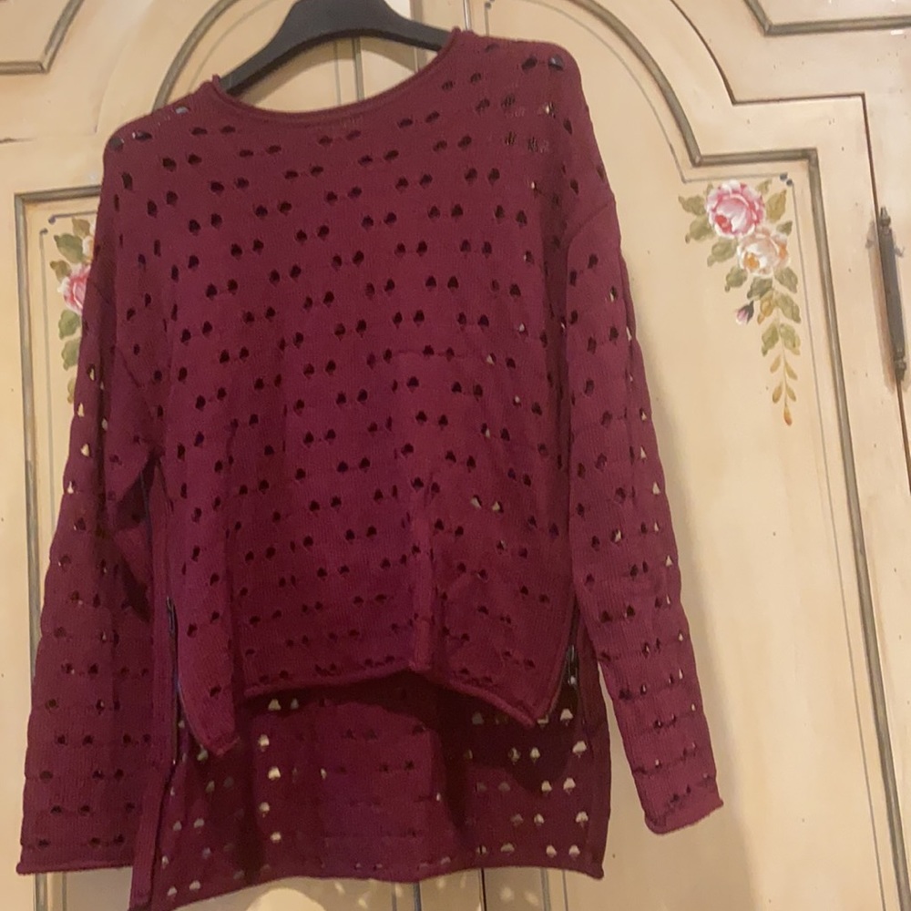 Parker long sweater with zippers on side.